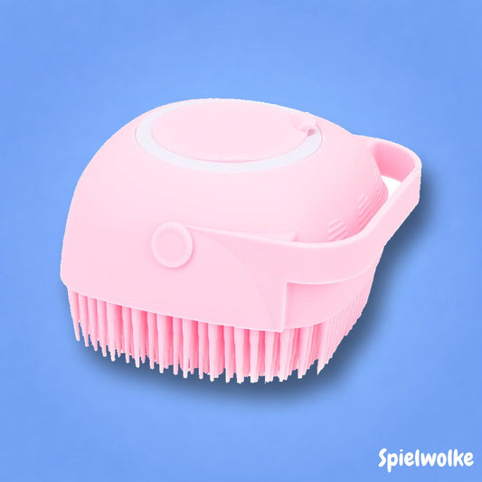 Baby-Massagebürste in Pink auf blauem Hintergrund